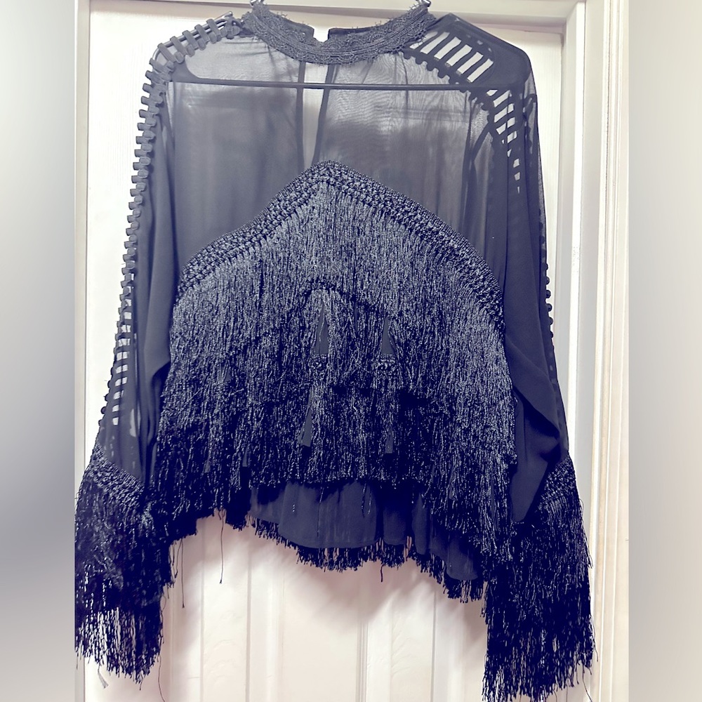 Elegant fringe blouse in sheer black from N by Nancy should be in your closet.